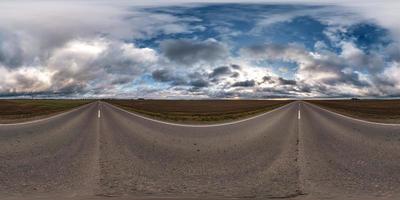 full seamless spherical hdri panorama 360 degrees angle view on asphalt road among fields in autumn day with beautiful clouds in equirectangular projection, ready for VR AR virtual reality content photo