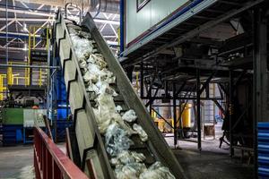 moving conveyor transporter on Modern waste recycling processing plant. Separate and sorting garbage collection. Recycling and storage of waste for further disposal. photo