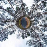 Little planet transformation of spherical panorama 360 degrees. Spherical abstract aerial view in field with awesome beautiful clouds. Curvature of space. photo