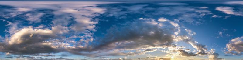 Seamless hdri panorama 360 degrees angle view blue evening sky with beautiful clouds before sunset without ground with zenith for use in 3d graphics or game development as sky dome or edit drone shot photo