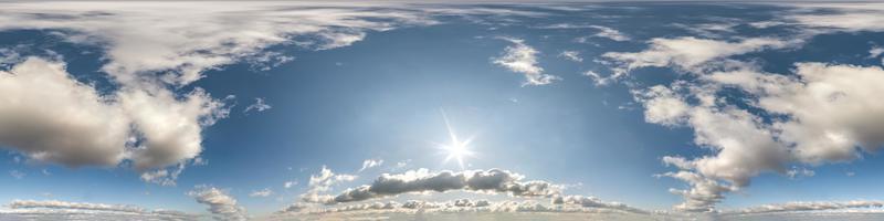 Seamless hdri panorama 360 degrees angle view blue sky with beautiful cumulus clouds with zenith for use in 3d graphics or game development as sky dome or edit drone shot photo