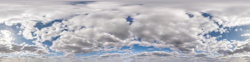 Seamless hdri panorama 360 degrees angle view blue sky with beautiful fluffy cumulus clouds with zenith for use in 3d graphics or game development as sky dome or edit drone shot photo