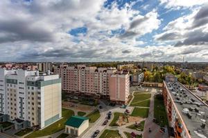 Panoramic view on new quarter high-rise building area urban development residential quarter in the cloudy autumn from a bird's eye view. life in a big city photo