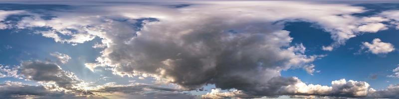 blue sky with beautiful dark clouds before storm. Seamless hdri panorama 360 degrees angle view with zenith for use in 3d graphics or game development as sky dome or edit drone shot photo