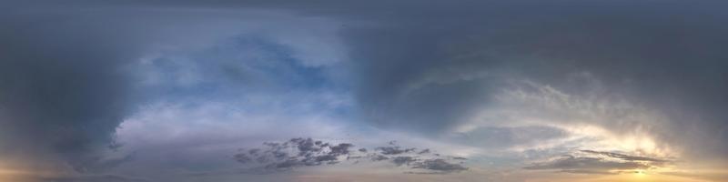 dark blue sky before sunset with beautiful awesome clouds before storm. Seamless hdri panorama 360 degrees angle view with zenith for use in graphics or game development as sky dome or edit drone shot photo