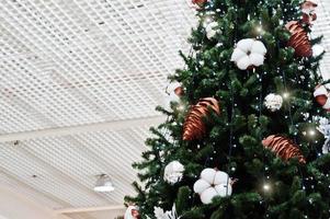 Large New Year tree with decorations in shopping mall. photo