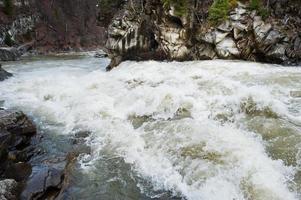 Incredible and stormy Prut river at Carpathian mountains, Jaremcze resort, Ukraine, Europe. photo