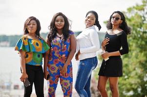 Group of four african american girls posed outdoor in good mood. photo