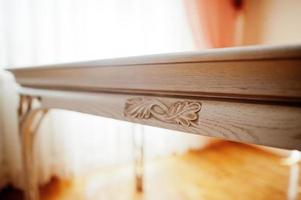 White wooden carved table in flat. photo