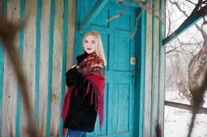 Blonde girl with hand embroidered scarf posed at winter day. Women's handkerchief. photo