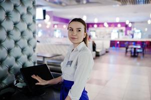 Waiter girl working with pos terminal or cashbox at cafe. People and service concept photo