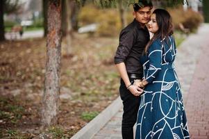 Love story of indian couple posed outdoor. photo