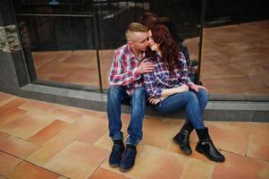 Stylish couple wear on checkered shirt in love together. photo