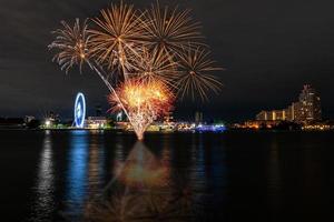 fireworks on the river in the dark sky photo