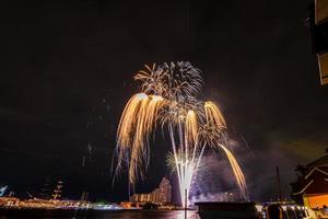 fireworks on the river in the dark sky photo