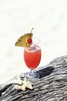 fruit cocktail on a tropical island beach photo