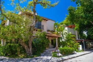 Luxury authentic historical villa in shadow of trees in Playa del Carmen, Yukatan, Mexico photo