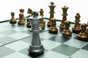 gold and silver chess on board close up image abstract Background. photo