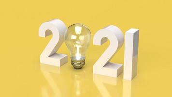 The number 2021 and Light bulb on yellow background 3d rendering. photo