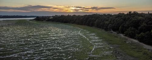 Low tide aerial view of mud flats photo