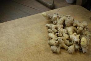 Ginger on wood plate for food content. photo