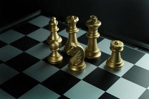 gold and silver chess on board close up image abstract Background. photo