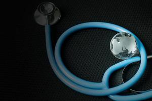 stethoscopes on black background image close up photo