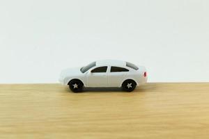 white car toy on wood table  image close up. photo