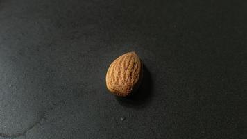 The Almond on black Ceramic Plate close up image. photo