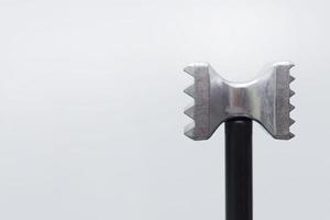 steel meat hammer close up image on white background studio light. photo