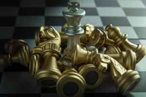 gold and silver chess on board close up image abstract Background. photo