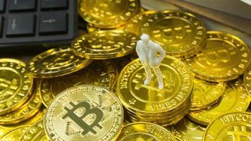 white miniature and gold coin bitcoin abstract image close up background. photo