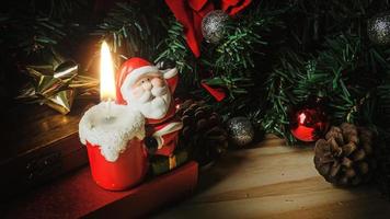 Santa Claus candle on wood table for Christmas  content. photo