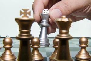 gold and silver chess on board close up image abstract Background. photo