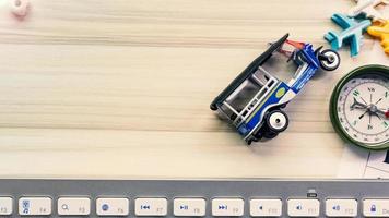 tuktuk on white  office  table for travel content. photo