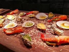 fresh sea food on counter bar in restaurant. photo