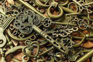 Old vintage keys gold texture on copper coin  abstract background. photo