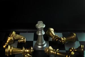 gold and silver chess on board close up image abstract Background. photo