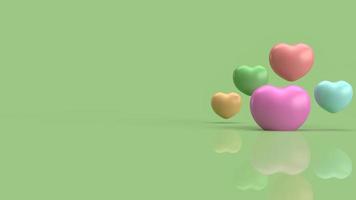 The  heart multi colour   on green background for abstract content 3d rendering photo
