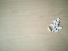 medicine close up image on wood table. photo