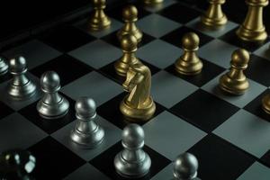 gold and silver chess on board close up image abstract Background. photo