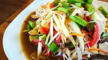 The Somtam or green Papaya Salad Thai food close up image. photo