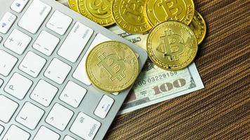 Bitcoin coin on silver keyboard for  cryptocurrency content. photo