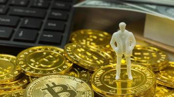 white miniature and gold coin bitcoin abstract image close up background. photo