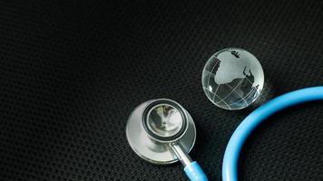 stethoscopes on black background image close up photo