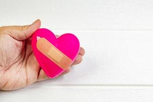 pink Heart and hand for medical content. photo