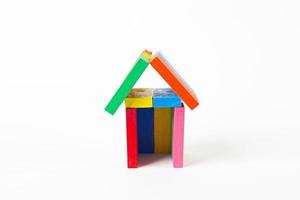 The domino multi color build home on white background. photo