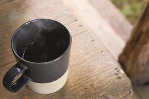 Morning coffee cup on wood table. photo