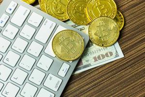 Bitcoin coin on silver keyboard for  cryptocurrency content. photo