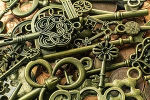 Old vintage keys gold texture on copper coin  abstract background. photo